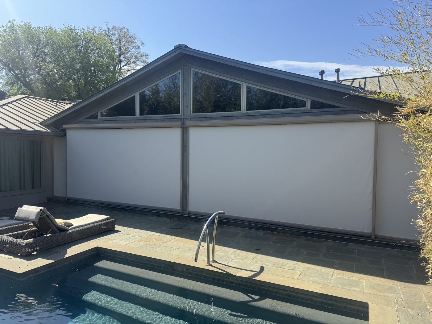 White screens poolside mid-century home